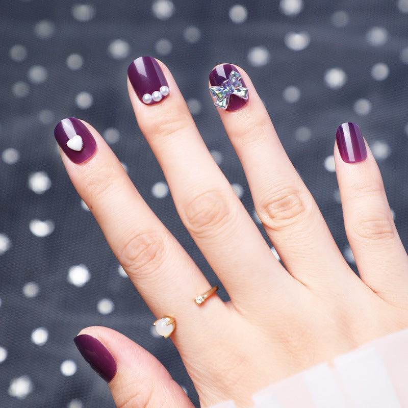 Wearing Nails With Diamonds And Purple Fake Nails - Image 5